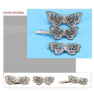 Bow hair clip set with sparkling rhinestones and pearl detail in acetate and metal
