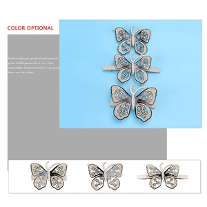 Barrette papillon évidée en acétate avec strass tchèques et finition en émail noir