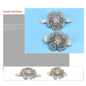 Elegant camellia flower acetate hair clip with rhinestones and pearl detail