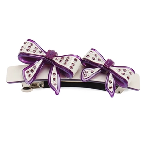 Detail view of purple acetate bow hair clip with sparkling Czech rhinestones and spring clip