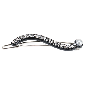 Detail of wavy resin hair clip with two rows of rhinestones and a grey-blue pearl