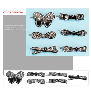 Set of six black acetate hair clips with sparkling rhinestones in butterfly shapes