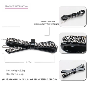 Detail view of black acetate bow hair clip with sparkling rhinestones and measurements