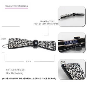 Detailed view of 6.3cm black acetate hair clip with rhinestones and anti-slip spring