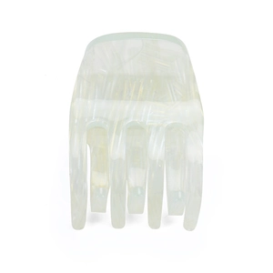 Detail view of pearlescent white acrylic hair claw clip with marble texture for women