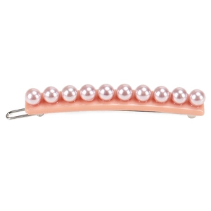 Detailed view of pale peach resin barrette with linear pinkish-purple pearls and silver clip