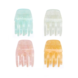 Floral acrylic hair claw clips in pastel marble textures for minimalist daily styling