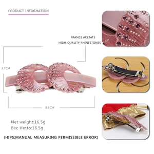 Pink acetate hair clip with rhinestones and satin storage bag, size 8.8cm by 3.7cm