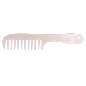Detail of light pink wide-tooth acetate comb with ergonomic handle and hanging hole