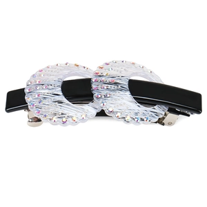 Elegant round acetate hair clip with sparkling rhinestones and a metal spring clip