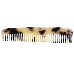 Macro detail of the smooth tortoise shell texture and anti-static acetate hair comb teeth