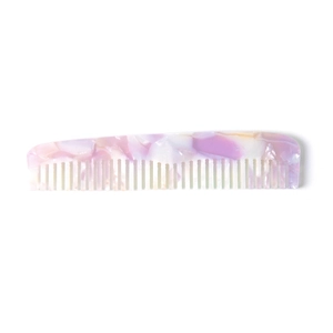 Detailed macro view of pink marble texture on an anti-static acetate hair comb
