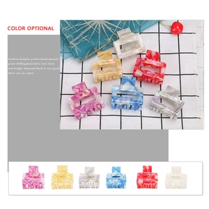 Colorful geometric acetate hair claws in various marble textures and colors