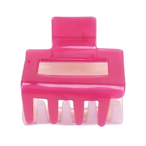 Macro view of geometric hollow hair claw with bicolor pink and purple resin design