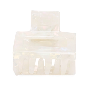 Detail view of square acetate hair claw clip with creamy white pearlescent marble texture
