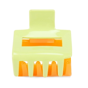 Detail of square hair claw clip featuring neon green frame and bright orange inner teeth