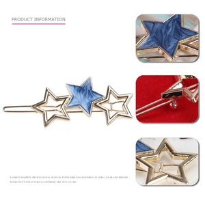 Elegante gouden holle ster haarspeld met blauw gemarmerd decoratief accent voor dames