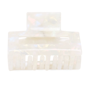 Detailed view of iridescent white acetate square hair claw with pearlescent marble texture