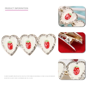 Sweet heart shaped strawberry hairpin with gold metal base and handmade crystals