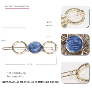 Minimalist alloy hair clip with blue marble resin and hollow circles design