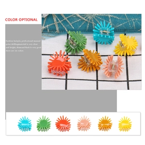 Colorful sunflower hair clips set in blue, green, orange, pink, amber, and yellow