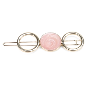 Detail of a gold alloy hair clip featuring three rings and pink marble texture finish