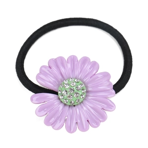 Detail of purple acetate daisy hair tie with small rhinestones on black elastic band