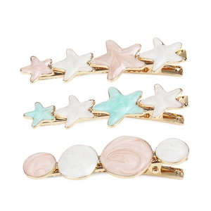 Lot de trois barrettes à cheveux étoiles et cercles avec émail marbré et alliage doré