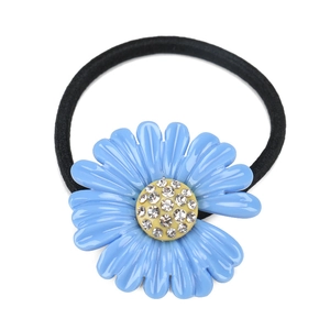 Detailed shot of sky blue daisy hair tie with sparkling rhinestone center and black elastic