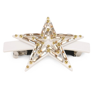 Star-shaped hair clip with champagne rhinestones and gold studs on a white base