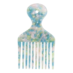 Macro detail of wide-tooth hair pick with blue and green marble acetate patterns