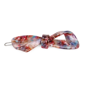 Detail of colorful marble acetate bow hair clip with side metal fastener mechanism