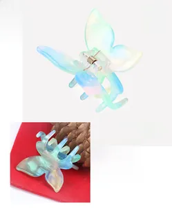 Détail d'une pince à cheveux papillon en acétate dégradé avec dimensions indiquées