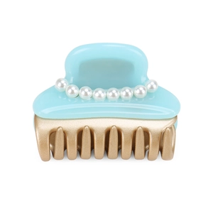 Detail shot of sky blue acetate hair claw clip featuring elegant single row pearls