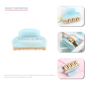 French acetate mini hair claw with sparkling blue rhinestones and gold teeth grip