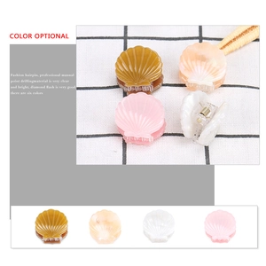 Mini shell-shaped acetate hair claw clips in four marble colors for girls