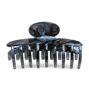 Detailed view of large marble texture acetate hair claw clip with multi-teeth design