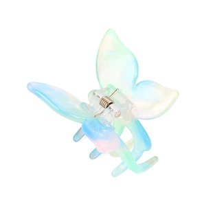 Vue détaillée de la pince à cheveux papillon en acétate avec dégradé de couleurs pastel