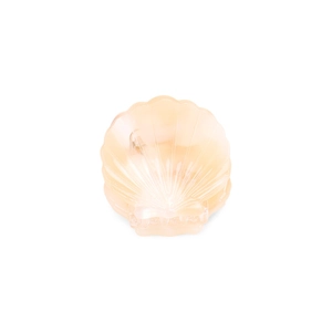 Close-up of a small acetate hair claw clip with a peach shell shape and ribbed texture