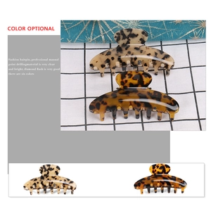 Large acetate hair claw clip with stylish tortoiseshell patterns in light and dark colors