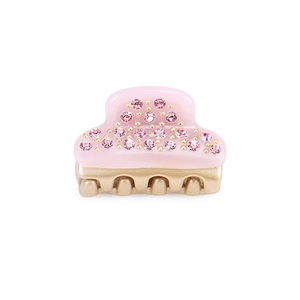 Detail view of mini pink acetate hair claw clip with rhinestones and gold metal beads