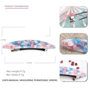 Detail view of pink and blue marble acetate hair clip with dimensions and metal spring clip
