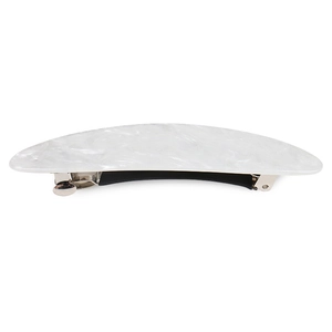 Macro shot of white marble pattern resin hair clip with silver spring buckle