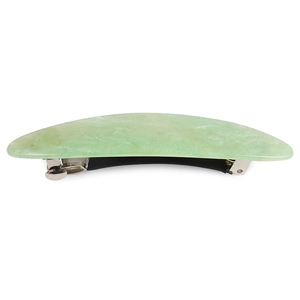 Detail view of a light green marble acrylic hair clip with subtle glitter and metal spring