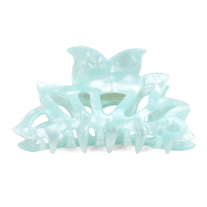 Detailed macro view of mint blue acetate hair claw clip with pearlescent marble texture