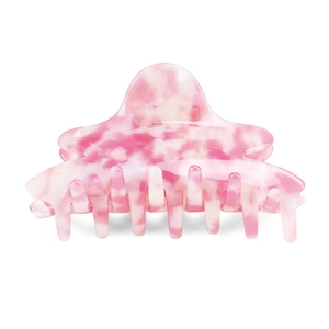 Detail of pink and white marble pattern hair claw clip made of premium acetate