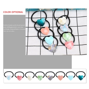Set of six colorful heart acetate hair ties with marble patterns for ponytails