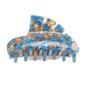 Detail showing blue and yellow marble texture on the acetate hair claw clip