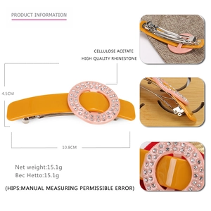 Chic acetate hair clip with yellow base, pink oval insert and sparkling rhinestones