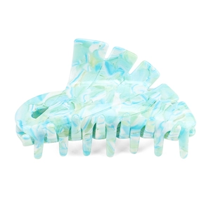 Large acetate hair claw clip with blue green and white marble pattern on white background